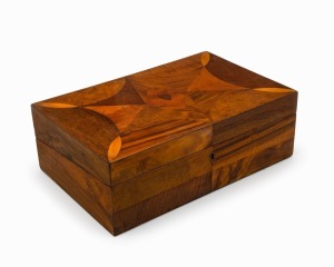 A superb Colonial Australian writing box, exceptionally crafted with numerous segments of native timbers including huon pine, musk, beefwood, tulipwood, myrtle, honeysuckle and others, interior fitted with writing slope with later tooled and embossed black leather top, Tasmanian origin, mid 19th century, attractive petite proportions 12cm high, 36cm wide, 23cm deep