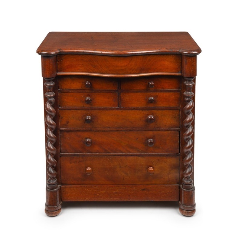 An antique Australian cedar apprentice chest, beautifully crafted with serpentine top, full barley twist columns and eight drawers, original polish and finish throughout, a fine example, circa 1875, ​​​​​​​50cm high, 47cm wide, 30cm deep