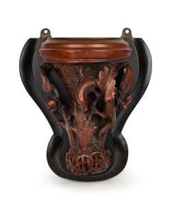 An antique carved timber wall bracket in the manner of Robert Prenzel, with oak leaf and salamander lizard decoration, adorned with intricate monogram, 19th/20th century, 26cm high overall