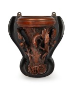 An antique carved timber wall bracket in the manner of Robert Prenzel, with oak leaf and salamander lizard decoration, adorned with intricate monogram, 19th/20th century, 26cm high overall