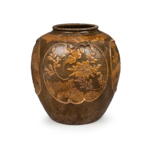 An antique Chinese ceramic jar with floral vignettes, Qing Dynasty. 35cm high, 32cm wide