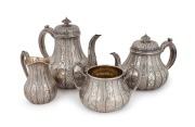 An antique English sterling silver tea service with chased and engraved decoration by John Samuel Hunt of London, 1851. Note:&nbsp;John Samuel Hunt had an enduring relationship working together with Paul Storr, working under several entities over many years. t