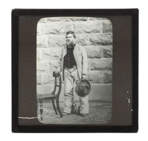 An original glass magic lantern slide of HARRY POWER; Charles Nettleton's portrait of Power, also known as Henry Johnson, an early associate of Ned Kelly. The slide maker is unknown, but probably J. Searle of Melbourne; 1890s, 82 x 80mm.