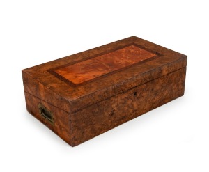 An exceptional Colonial Australian writing box, beautifully crafted with selected cuts of musk, huon pine, rosewood and cedar, interior fitted with huon pine topped compartments and purple velvet slope, Tasmanian origin, circa 1840, 14.5cm high, 46cm wide, 25.5cm deep