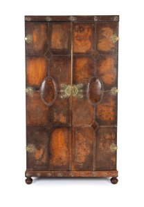 A vintage English reproduction two door wardrobe with studded leather finish, circa 1930s, ​​​​​​​182cm high, 104cm wide, 49cm deep