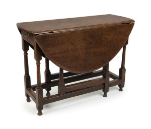 An antique English oak George II oval gate-leg drop-leaf table, turned stretcher base with peg joint construction, circa 1740, 71cm high, 39cm wide (113cm extended), 101cm deep