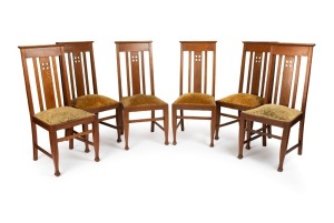 A set of six antique oak dining chairs in the English Arts & Crafts style, showing the influence of Charles Rennie Macintosh, early 20th century, 105cm high
