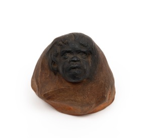 WILLIAM RICKETTS pottery sculpture with Aboriginal face and engraved inscription to the base "Out of the rocks they come, spirits from the eternal sun", incised "Wm. Ricketts", 6cm high