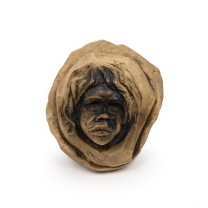 WILLIAM RICKETTS miniature face mask sculpture, incised "Wm. Ricketts", 6cm high