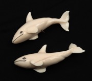 Two carved marine ivory whale ornaments, 20th century, the larger 10.5cm long - 2