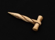 An antique carved whalebone fid hand-tool, 8.5cm high - 2
