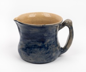 MERRIC BOYD blue glazed pottery jug, incised "Merric Boyd, 1916", 12cm high, 18.5cm wide