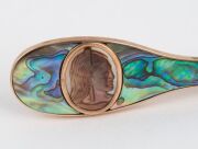 An antique New Zealand 9ct rose gold and paua shell brooch in the form of a patu, adorned with Maori cameo portrait, 19th/20th century, stamped "9ct, H.J.B.", ​​​​​​​5.2cm wide, 7.8 grams total - 3