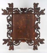 An antique Australian carved kauri pine picture frame with grape and vine motif, housing a watercolour of Notre Dame signed "H. Medleykof (?)", 19th century, 67 x 69cm, internal size 40 x 33cm - 2