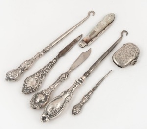 An antique mother of pearl and sterling silver pocket fruit knife, sterling silver vesta, three boot hooks and two manicure implements, 19th/20th century, (7 items), the largest hook 18cm long
