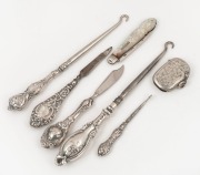 An antique mother of pearl and sterling silver pocket fruit knife, sterling silver vesta, three boot hooks and two manicure implements, 19th/20th century, (7 items), ​​​​​​​the largest hook 18cm long