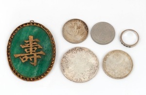 A white gold ring, set with seven emeralds, together with a Chinese jade pendant in gilt metal mount, and four assorted coins, (6 items)