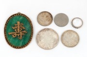 A white gold ring, set with seven emeralds, together with a Chinese jade pendant in gilt metal mount, and four assorted coins, (6 items)