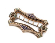 A stunning antique rose gold buckle sumptuously adorned with enamel decoration, housed in original gilt embossed scarlet leather plush fitted case, most likely Imperial Russian, late 19th early 20th century, ​​​​​​​9cm high, 5cm wide, 35 grams