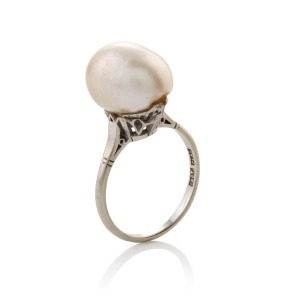 A vintage 18ct white gold and platinum ring, set with an impressive natural pearl (16 x 10mm), stamped "18ct, PLAT.", 8.4 grams total