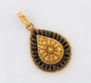 An Indo-Persian 22ct gold and blue sapphire pendant, 20th century, stamped "22K", 4cm high including loop, 6.6 grams
