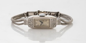 An Art Deco 18ct white gold and diamond encrusted lady's wristwatch circa 1930, case stamped "HANDLEY, 18C."