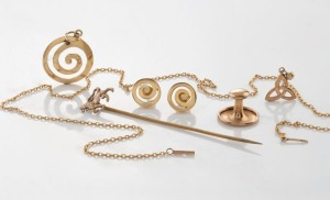 A 9ct gold lion stickpin, a 9ct gold stud, a 9ct gold chain, 14ct gold earrings and pendant, 9.7 grams total