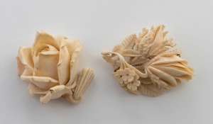 An antique carved ivory rose pendant, together with an antique carved ivory brooch, 19th/20th century, (2 items), the pendant 7.5cm high overall