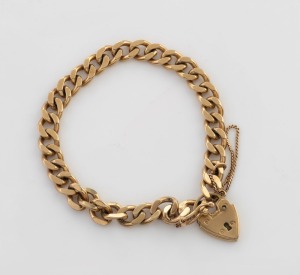 A 9ct yellow gold curb link bracelet with heart lock, stamped "375", 19.5 grams