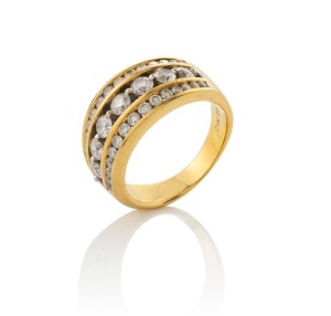 An 18ct yellow gold ring, set with three rows of brilliant cut white diamonds, stamped "18K, 750, MHJ", 9.6 grams