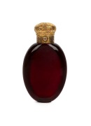 An antique English ruby glass scent bottle with engraved gold top, circa 1860, 9.5cm high
