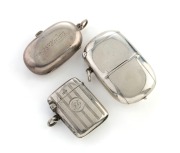 An antique sterling silver double sovereign case, a sterling silver vesta case, and a sterling silver combination sovereign vesta case, 19th/20th century, (3 items), the largest 6.5cm long, 84 grams total