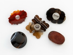 Five assorted Scottish agate and carnelian brooches with sterling silver mounts, 19th/20th century, the largest 5cm wide