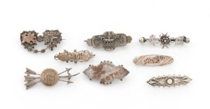Eight assorted antique silver brooches, three with rose gold highlights, 19th century, the largest 4.5cm wide, 35 grams