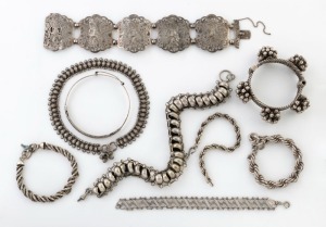 Nine assorted Eastern and tribal silver bracelets, bangles and necklaces, 230 grams total