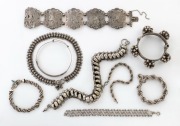 Nine assorted Eastern and tribal silver bracelets, bangles and necklaces, 230 grams total