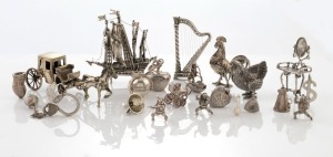 CHARMS & ORNAMENTS, mostly silver, including a galleon, a harp, two chickens, a horse and carriage, and the Teenage Mutant Ninja Turtles, mixed vintages and origins, (21 items), the galleon 7cm high, 270 grams total