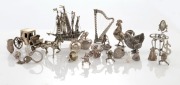 CHARMS & ORNAMENTS, mostly silver, including a galleon, a harp, two chickens, a horse and carriage, and the Teenage Mutant Ninja Turtles, mixed vintages and origins, (21 items), the galleon 7cm high, 270 grams total&nbsp;