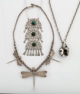 A silver and cabochon stone necklace, a silver dragonfly necklace, and a silver designer necklace with double face mask pendant, 20th century (3 items), 194 grams total