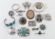 Assorted silver brooches, bangles, shoe buckle, fist pendant, kilt pin, enamel brooch, turquoise jewellery, etc. 19th and 20th century, (18 piece)