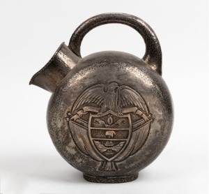 A vintage hand-beaten silver water jug with repousse and engraved decoration, 20th century, 28cm high, 830 grams