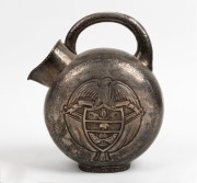 A vintage hand-beaten silver water jug with repousse and engraved decoration, 20th century, 28cm high, 830 grams