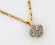 A 9ct yellow and white gold heart shaped pendant, pave set with brilliant cut white diamonds, suspended on an 18ct yellow gold chain, the pendant 3cm high overall and 6.3 grams, the chain 46cm long 13.9 grams