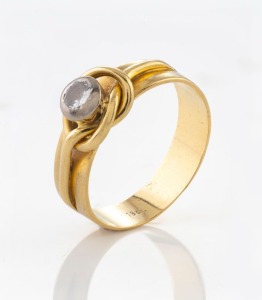 An 18ct yellow gold ring, set with a solitaire diamond, stamped "18ct", 5.5 grams