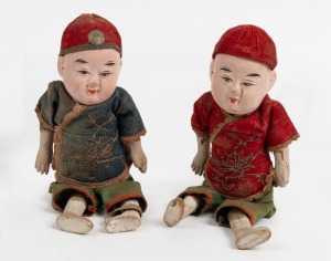 A pair of antique Chinese papier-m&acirc;ch&eacute; dolls in original silk costumes, 19th/20th century, 22cm high