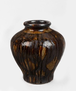 A Japanese stoneware pot with raku glaze, 27cm high