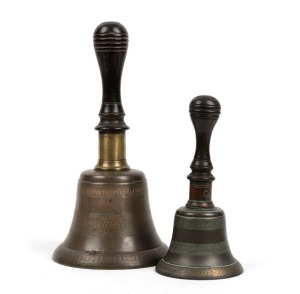 Two antique bells with engine turned decoration and turned ebony handles, 19th century, 17.5cm and 25.5cm high