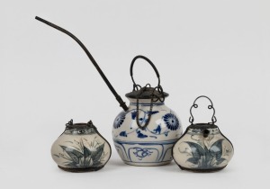 Three assorted Chinese porcelain opium pipes, one complete, the other two missing stems and tops, 19th/20th century, the largest 20cm high