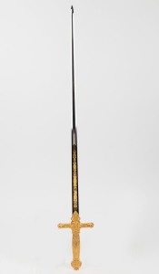 A vintage dress sword with ornate gilt metal hilt and decorative blade, 20th century, 86cm long