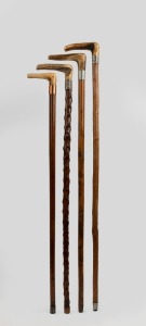 Four assorted antique and vintage walking sticks with deer antler handles, metal collars and ferrules, 19th and 20th century, the largest 89cm high